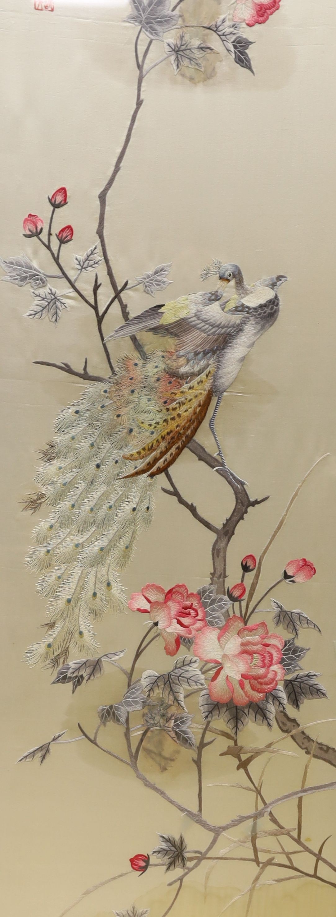 A Chinese silkwork panel of a peacock upon flowering branches, 112 x 35cm and a colour print of Chinese polo players